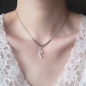 Antique white pearl necklace with a small silver chain